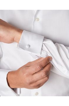 Modern French cuffs add elegance to a spread-collar dress shirt richly woven from pure cotton. Since 1928, Eton has been making men’s shirts that meet the highest expectations of quality, fusing Scandinavian sensibilities and the rich traditions of English textiles. They make a shirt that is well worth wearing, and because they take ownership of the production process from day one, the quality never wavers. Permanent collar stays. French placket. Curved hem. Back yoke. 100% cotton. Machine wash Cheap White Men's Dress Shirt, Affordable White Men's Dress Shirt, San Francisco City Hall Elopement, Make A Shirt, City Hall Elopement, Pearl Cufflinks, Swedish Brands, Cutaway Collar, Modern French