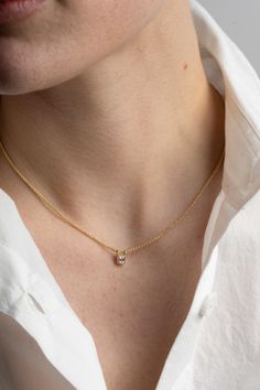 The "Una", a classic single stone solitaire necklace. A shimmery carre cut antique diamond set in a simple bezel setting and hung on a 14k wheat chain. 14k Gold .3c Diamond Made in San Francisco of recycled materials True to the founding ethos of Reliquary these special pieces are part of a small collection of fine jewelry inspired by our travels. Timeless Everyday Solitaire Necklace With Prong Setting, Timeless Solitaire Necklace For Everyday, Timeless Everyday Solitaire Necklace, Everyday Classic Solitaire Necklace With Single Cut Diamonds, Timeless Prong Setting Necklace For Everyday, Timeless Everyday Necklace With Prong Setting, Classic Jewelry With Bezel Setting In Recycled Gold, Classic Jewelry In Recycled Gold With Bezel Setting, Classic Square Pendant Diamond Necklace With Single Diamond