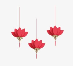 three red paper flowers hanging from strings