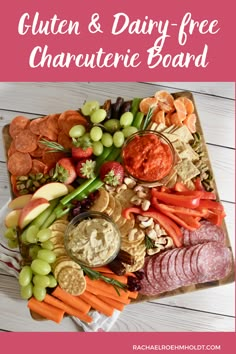 a platter filled with cheese, crackers and fruit for a gluten and dairy - free charcuterie board