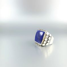 Classic and modern square cabochon blue Lapis Lazuli ring with Sterling silver. Unique gift for her or him, friend, girlfriend, wife, boyfriend, man September and December birthstone, 9 yeaar anniversary. The beautiful royal blue Lapis Lazuli is cut as a classic cabochon and set in Sterling silver with small dots of silver and 18k gold. All our stones are natural stones and our jewelry is handmade, very slight differences may occur in color and size. Our inlay work is all natural stone, NOT pres Anniversary Signet Ring With Rectangular Gemstone, Elegant Blue Gemstone Signet Ring, Modern Rectangular Rings With Accent Stones, Luxury Rectangular Rings For Gift, Luxury Rectangular Rings As A Gift, Luxury Rectangular Rings As Gift, Luxury Blue Square Cut Ring, Rectangular Sterling Silver Signet Ring With Gemstone, Modern Cabochon Sapphire Ring For Gift