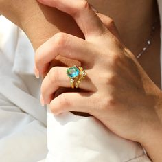 a close up of a person wearing a ring