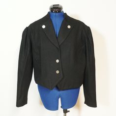 Very nice spencer jacket in black with wide club sleeves and a beautiful collar. It fastens at the front with metal buttons. The jacket is worn but in very good condition. The size is about 46/L Here are the measurements:  Chest width: 116cm  Waist size: 108cm  Length: 49cm  Sleeve length: 58cm Jacket With Collar, Spencer Jacket, Traditional Jacket, Womens Jackets, Metal Buttons, Waist Size, Porter, Jackets & Coats, Germany