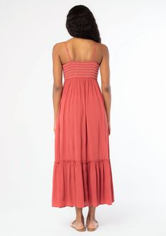 A timeless bohemian maxi dress you'll be reaching for all season. Designed in a flowy crinkle gauze, this effortless dress features a slim-fit smocked bodice with contrast thread detail, adjustable spaghetti straps, and must-have side pockets. Crinkle gauze Slim fit smocked bust Flowy skirt Sleeveless Maxi length Ruffle-trimmed tiered skirt Straight neckline Contrast thread detail Button front Adjustable spaghetti straps Side pockets Flowy bohemian maxi dress Model is 5'9, wearing a size S.Style Flowy Maxi Length Smocked Dress For Vacation, Bohemian Tiered Sundress With Smocked Back, Bohemian Ruched Maxi Sundress, Casual Flowy Empire Waist Maxi Dress, Bohemian Smocked Maxi Dress For Brunch, Flowy Smocked Dress With Empire Waist, Empire Waist Ruched Bodice Sundress, Ruched Empire Waist Maxi Dress For Beach, Flowy Casual Maxi Dress With Elastic Neckline