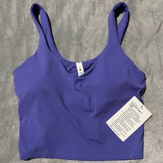 Nwt, I Got This As A Gift So The Price Is Cut Off But It Is Too Small For Me. Super Cute Color - It’s Like A Blueish Purple Purple Activewear With Built-in Bra For Light Exercise, Casual Purple Sleeveless Sports Bra, Purple Bra-friendly Tops For Yoga, Purple Moisture-wicking Tops For Yoga, Purple Moisture-wicking Yoga Tops, Purple Seamless Sleeveless Activewear, Purple Sleeveless Seamless Activewear, Purple Moisture-wicking Sports Bra For Pilates, Moisture-wicking Purple Sports Bra For Pilates