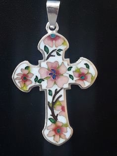 Beautiful  cross Pendant with Cloisonne Enamel, exclusive products,  Author's work, handmade. 999 sterling silver. height:   4 Centimeters;  width:   2.5 Centimeters The art of Georgian cloisonne enamel is ancient. Known since the 8th century. Cloisonne enamel developed simultaneously in Georgia and Byzantium. Georgian cloisonne enamel is characterized by abundance of colors and deep transparency, accompanied by a sense of Georgian beauty and Georgian spirit. Cloisonne enamel is one of the most elegant jewelry techniques. On a metal plate (usually silver, copper or yellow gold), a drawing is laid out using thin wires (usually silver). The wires play the role of "partitions" inside which the enamel is placed. In the old days, this technique often played the role of a retinue around the "kin Enameling Jewelry, Enamel Cross, Beautiful Cross, Jewelry Techniques, Cloisonne Enamel, Metal Plate, Jewellery Sets, Elegant Jewelry, Cross Pendant