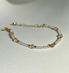 Joy * Positivity * Abundance  - 2mm Citrine beads  - 4mm Citrine beads  - Gold plated  - +2in adjustable chain  Please don't hesitate to contact me if you have any questions!  ☺️ Illuminate your path with our citrine bracelet, a radiant beacon of warmth and optimism. Known for its vibrant golden hues and energizing properties, citrine helps unlock your inner abundance and creativity. Wear this luminous bracelet as a talisman to attract positivity, boost your confidence, and celebrate the joy tha Adjustable Citrine Yellow Gold Jewelry, Adjustable Yellow Gold Citrine Jewelry, Dainty Adjustable Yellow Jewelry, Gold Faceted Beaded Bracelets For Everyday, Adjustable Gold Faceted Beaded Bracelet, Adjustable Faceted Gold Beaded Bracelet, Adjustable Yellow Gold Beaded Bracelets With Faceted Beads, Adjustable Faceted 14k Gold Filled Bracelets, Elegant Adjustable Amber Crystal Bracelet