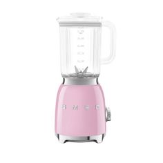 a pink blender sitting on top of a white table