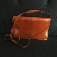 Bally Vintage Shoulder Bag Navy Leather . Condition Is Pre-Owned. Over All Good Condition. May Be Carried A Clutch Or Worn As Shoulder Bag Or Crossbody. 10” L X 7”H X 4” D Strap Drop 21” Formal Tan Satchel Shoulder Bag, Cognac Shoulder Bag For Evening, Brown Satchel Evening Bag With Adjustable Strap, Tan Crossbody Shoulder Bag For Evening, Formal Brown Crossbody Bag, Vintage Brown Flap Bag For Evening, Vintage Leather Travel Clutch, Brown Vintage Flap Bag For Evening, Cognac Crossbody Shoulder Bag For Evening