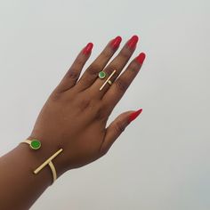 Gold Colored Brass Bangle and  Ring Set Luxurious Dainty and Elegant bangle and ring set in emerald green .  Handcrafted in Kenya with brass and recycled glass, showing African Workmanship at it best  Features  Adjustable Artisan Bracelet Materials: Brass Size: One size Colour: Gold Modern Green Emerald Jewelry, Elegant Green Metal Cuff Bracelet, Modern Green Brass Jewelry, Green Metal Bangle Jewelry, Minimalist Brass Bangle, Green Brass Jewelry For Gifts, Green Brass Jewelry As Gift, Green Brass Jewelry For Gift, Green Cuff Bracelet Gift