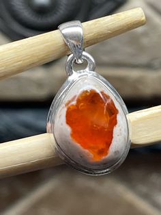 Handmade, natural product Stone: Genuine Mexican Fire Opal Metal: 925 Sterling Silver Gemstone size: 18mm X 15mm Untreated Red Sterling Silver Jewelry, Silver Carnelian Teardrop Jewelry, Silver Teardrop Carnelian Jewelry, Orange Sterling Silver Jewelry With Gemstone, Untreated Amber Jewelry Gift, Sterling Silver Jewelry With Large Amber Stone, Sterling Silver Amber Jewelry With Large Stone, Sterling Silver Orange Cabochon Jewelry, Red Sterling Silver Jewelry With Large Stone