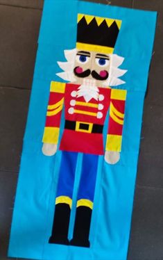 a paper cut out of a nutcracker with a mustache and moustache