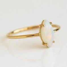 Dainty minimalist opal ring, prong setting, 18k gold plated over sterling silver. Minimalist 14k Yellow Gold Opal Ring, Dainty 14k Yellow Gold Opal Ring, Everyday 14k Yellow Gold Opal Ring, Dainty Gold Opal Ring In 14k, Dainty Gold Opal Ring In 14k Gold, Dainty Yellow Gold Opal Jewelry, Minimalist Everyday Opal Jewelry, Delicate Gold Opal Ring, Delicate 14k Gold Opal Birthstone Ring