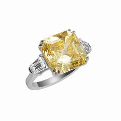 Sterling silver yellow stone ring featuring an asscher cut simulated yellow diamond .. A Beautiful statement ring that is guaranteed to turn heads! Sku GAR0162