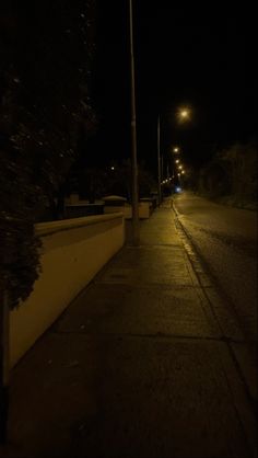 an empty street at night with no one on it