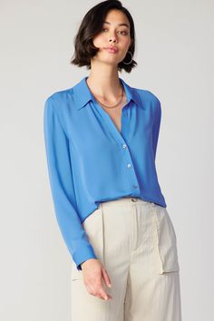 A classic button-up shirt is the kind of wardrobe staple you can style for almost any occasion. Designed to be worn with the collar undone, this long-sleeve silhouette has a relaxed fit with a shirttail hem and a single pleat at the back. It's versatile and effortless—an easy piece to dress up or down. •Pointed collar •Button front placket •Long sleeves •Relaxed fit •Shirttail hem Item number 2330278-1 100% Polyester