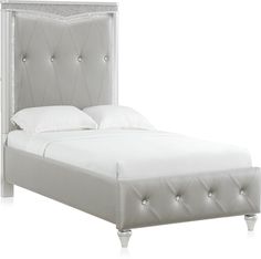 a white bed with an upholstered headboard and foot board on the side