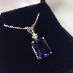 "Beautiful Blue & White Sapphire Pendant Necklace * 4ct Emerald Cut Blue Sapphire measures 10mm x 8mm * Brilliant Cut White Sapphire Accent measures 2.5mm * 4.1cts total gemstone weight * 14k White or Yellow Gold * 18\" Sterling Silver link Chain Included Hallmarked & Gift Ready! Matching Earrings & Ring Also Available! This 4ct Sapphire is Laboratory Grown & is identical to natural in every way, including Chemistry, Composition & Hardness with Excellent Clarity & Color R Formal Emerald-cut Solitaire Necklace In Cubic Zirconia, Formal Emerald Cut Solitaire Necklace With Cubic Zirconia, Classic Sapphire Diamond Necklace With Brilliant Cut, Classic Sapphire Diamond Necklace For Formal Occasions, Formal Moissanite Gemstone Necklaces, Classic Sapphire Necklace For Formal Occasions, Classic Formal Sapphire Diamond Necklace, Sapphire Cubic Zirconia Jewelry For Jewelry Making, Sapphire Jewelry With Prong Setting As Gift