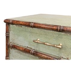 an old green painted dresser with brass handles