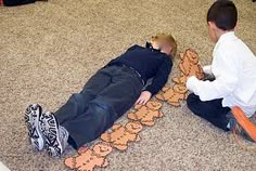 two boys laying on the floor with teddy bears