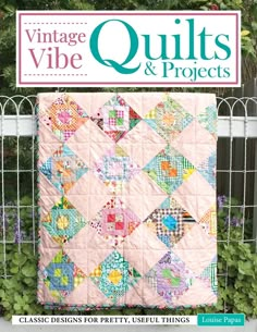 the cover of vintage vibe quilts and projects, featuring an image of a pink quilt