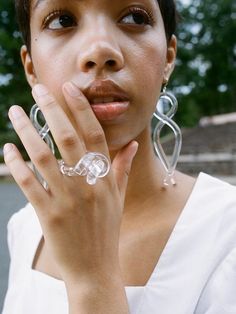 COREY MORANIS TWIST EARRINGS - LUCITE Forbidden Snacks, Africa Jewelry, Twist Earrings, Photoshoot Video, Cameo Earrings, Resin Jewellery, Knot Ring, Earrings Ring, Glass Rings