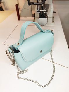 Mini handbag, baby blue leather mini bag, phone bag, miniature handbag, tiny leather bag. This mini handbag is in line with the latest trends. Made of baby blue natural leather, it has no lining or pockets and is finished in raw leather. It fastens with a snap closure. The sides are decorated with three silver-colored rivets, giving it a rockier feel. Additionally, it comes with a chain, allowing you to carry the handbag on your shoulder. Great as a gift for her. Dimensions: Height: 10 cm/ 3 inches Width: 18 cm/ 7 inches Bottom: 7 cm/ 2 inches Total length of the chain: 120 cm/ 47 inches Remember that each of our handbags is hand-sewn in our workshop, offering you the possibility of personalization. You can start by changing the color of the leather or material, add or remove elements (suc Blue Satchel Box Bag For Mobile Phone, Blue Satchel Box Bag With Mobile Phone Holder, Blue Pouch Box Bag For Mobile Phone, Blue Mobile Phone Pouch Box Bag, Blue Mobile Phone Box Bag Satchel, Chic Blue Mobile Phone Box Bag, Light Blue Mobile Phone Bag For Daily Use, Trendy Light Blue Leather Bag, Light Blue Rectangular Shoulder Bag With Phone Pocket