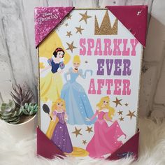 there is a sign that says sparkly ever after with princesses on it next to a succulent plant