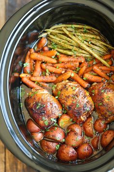 chicken, carrots and asparagus in a slow cooker