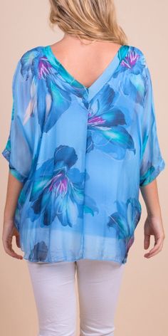 Floral Bloom Design on 100% Silk Blouse with Frayed Raw Edge Hemline. Soft, Stretchy Viscose Layer Underneath. 100% Silk Exterior | 95% Viscose | 5% Elastic Interior Made in Italy Fits Sizes XS- XL Model 5'7 Italy Fits, Bloom Design, Raw Edge, Italian Fashion, New Bag, Fashion Tops, Cheetah Print, Printed Blouse, Handbags On Sale