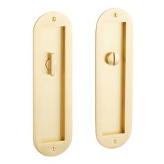 two brass door handles on white background