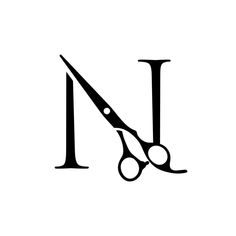 a black and white photo of a pair of scissors with the letter n on it