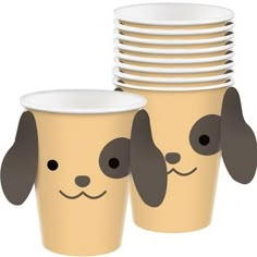 a stack of paper cups with dogs drawn on the sides and faces in different shapes