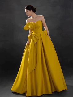 Evening Strapless Satin Dress With Bow, Elegant Strapless Gown With Bow, Strapless Wedding Dress With Satin Bow, Bow Evening Dress For Banquet During Prom Season, Yellow Gown For Banquet And Prom Season, Yellow Gown For Banquet During Prom Season, Yellow Satin Party Gown, Strapless Satin Evening Gown, Strapless Evening Gown With Bow