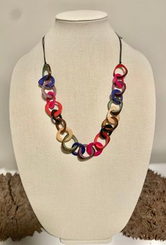 Handmade in Ecuador Necklace Length: 13 - 32 Inches Adjustable Length Material: Tagua Nut Due to this item being handmade and the nature of the Tagua Nut the size and the color may vary from piece to piece Multicolor Round Necklaces For Everyday, Everyday Multicolor Wooden Beads Jewelry, Everyday Multicolor Wooden Beaded Jewelry, Handmade Multicolor Circular Jewelry, Adjustable Multicolor Everyday Necklace, Adjustable Multicolor Everyday Necklaces, Multicolor Circle Necklace For Gift, Multicolor Circle Necklace Gift, Multicolor Adjustable Chain Beach Jewelry