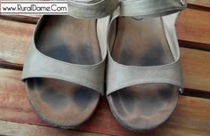 a pair of women's shoes sitting on top of a wooden floor next to each other