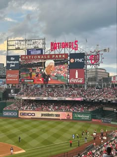 a baseball stadium filled with lots of people