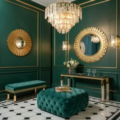 a living room with green walls, gold accents and a chandelier hanging from the ceiling