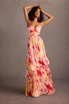 Our Lela Maxi Dress is crafted from a vibrant printed charmeuse fabric, combining a beautiful V-neckline and floor-length A-line ruffle skirt. Wear this beauty to your next formal day event, or wedding reception. Flowy Tiered Silk Maxi Dress, Flowy Silk Tiered Maxi Dress, Tiered Floral Print Maxi Dress For Evening, Floral Print Tiered Maxi Dress For Evening, Summer Silk Tiered Maxi Dress, Summer Tiered Silk Maxi Dress, Satin Maxi Dress For Garden Party, Summer Tiered Satin Dress, Summer Satin Tiered Dress