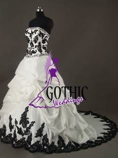 a white and black wedding dress on display