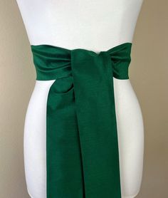 "Wide Textured Alpine Green Sash Belt  Green Dupioni Sash  Dark Green Dress Sash  Dupioni Belt  Green Wedding & Bridesmaid Sash  Satin Swank  Add rich color and texture to your special occasion outfit with this Satin Swank® dupioni sash belt. Depending on your waist size and the length you choose (75 and 90 inch lengths available), you can wrap this sash around your waist once or twice. You decide whether to tie the sash in a bow or a simple knot with long-hanging tails. Tie in front, in back, or on the side. A double layer of textured dupioni fabric in Alpine green. Sash is the same front and back with seams hidden within the fold lines and ends finished on the angle. Dupioni features a rustic weave with naturally occurring slubs running throughout the fabric resulting in exquisite depth, Formal Fitted Sash With Tie Back, Formal Fitted Sash With Tie Waist, Fitted Tie Back Sash For Evening, Fitted Evening Sash With Tie Back, Elegant Fitted Green Sashes, Fitted Bridesmaid Sash, Elegant Fitted Tie-waist Sash, Elegant Fitted Tie Waist Sash, Witch Oc