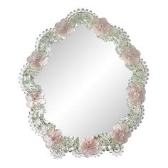 a round mirror with pink flowers on the rim and beading around the edge is shown