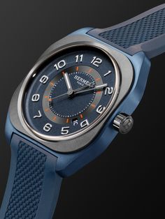 Hermès Timepieces' 'H08' reference is an athletic watch that packs an intricate Swiss-made movement in a distinctive cushion-shaped case. Made from hardy titanium with a contrasting satin-brushed ceramic bezel, this timepiece has a midnight-blue dial dotted with easy-to-read Arabic numerals and indices in the brand's signature orange. It's anchored by a durable textured rubber strap and has an exhibition case back so you can observe its inner workings. For warranty information, please refer to … Designer Blue Watches With Diamond Hour Markers, Designer Blue Watch, Designer Blue Chronograph Watch, Blazers Shoes, Rubber Watches, Luxury Sneakers, Summer Gifts, Driving Shoes, Classic Sneakers