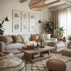 a living room filled with lots of furniture next to a wall mounted planter and potted plants