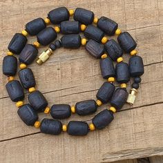 📿Necklace handcrafted with Black Shaded Tulsi Beads perfectely complimeted with rondelle Beige shaded tulsi beads. Tulsi Necklace is beneficial for people who have scattered minds and erratic behaviours, as it helps to keep the wearer focussed. 📿 🚪 NECKLACE DETAILS 🚪 📏Mala Beads size: 14 mm (Cylindrical) x 10 mm (Round) (Approx) 📏Mala Necklace Length: 19 inches 📏One Round 🚪 Pure Tulsi Beads Sourced from Vrindavan 📿 TULSI BEADS PROPERTIES 📿 🌹 Enormous physical healing powers 🌹 Rejuven Black Round Beads Jewelry For Rituals, Handmade Black Necklace With Oval Beads, Handmade Black Necklaces With Oval Beads, Artisan Black Beaded Necklace For Gift, Handmade Spiritual Black Necklace, Black Handmade Beaded Necklace For Healing, Handmade Black Beaded Necklaces For Healing, Black Handmade Beaded Necklaces For Healing, Artisan Black Necklace With Round Beads