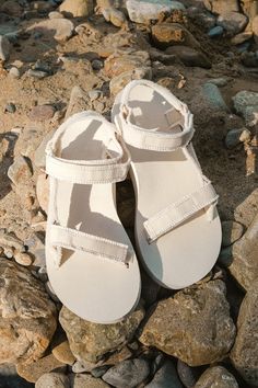 However you style the Teva Midform Universal Birch Canvas Sandals, they are sure to make any of your summer 'fits even more cute and comfortable! These sandals feature 100% recycled polyester canvas straps (adorned with trendy frayed trim) that shape an adjustable VELCROÂ® toe strap that leads to a matching quarter strap. An on-trend, flatform foam sole completes the summer-ready look! Logo tag accents outstep strap. Available in whole sizes only. 1. 25" flatform sole. Lightly cushioned insole. Cute Sandals For Summer, Thrift Manifest, Teva Midform, Wineries Outfit, Canvas Sandals, Church Camp, Teva Sandals, Cute Sandals, Dress Shoes Womens