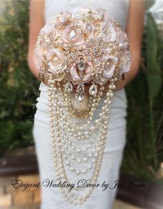 a bridal bouquet with pearls and flowers