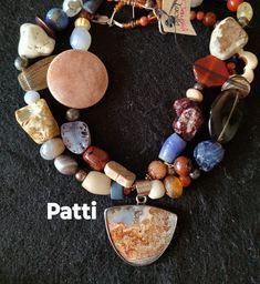 "Patti" Never leave home without some art around your neck. One Of A Kind artisan hand crafted painted jasper pendant. Carnelian, lapis, sterling tumbled stone, glass, sponge coral, white coral,  art beads, crazy lace jasper Custom Obsidian gemstone pendant  22 " from end to end Lobster clasp Item # 405 Multicolor Jasper Necklace For Gift, Artisan Handmade Jasper Necklaces, Handmade Jasper Beaded Necklaces, Handmade Unique Jasper Beaded Necklaces, Unique Handmade Jasper Necklace, Unique Beaded Necklaces With Gemstone Round Pendant, Unique Beaded Necklace With Round Gemstone Pendant, Handmade Jasper Artisan Beaded Necklaces, Handmade Jasper Beaded Necklaces Artisan Style