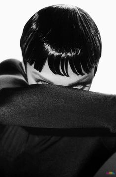 the back of a woman's head with black hair