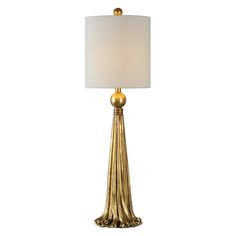 a gold lamp with a white shade on it